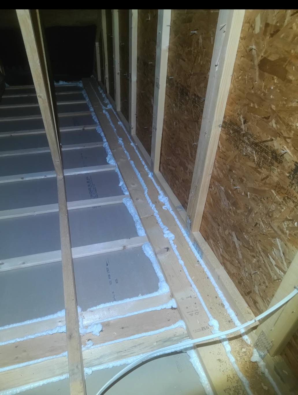 Foam air sealing along attic joists and top plates before insulation in Miami, FL